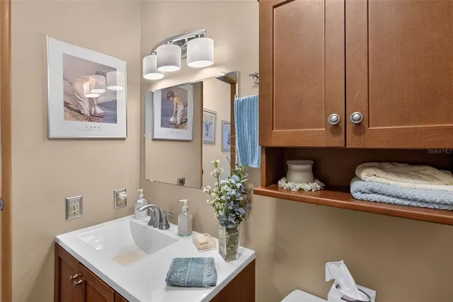 a view of a house with a big yard and large trees