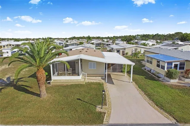 a view of a house with backyard