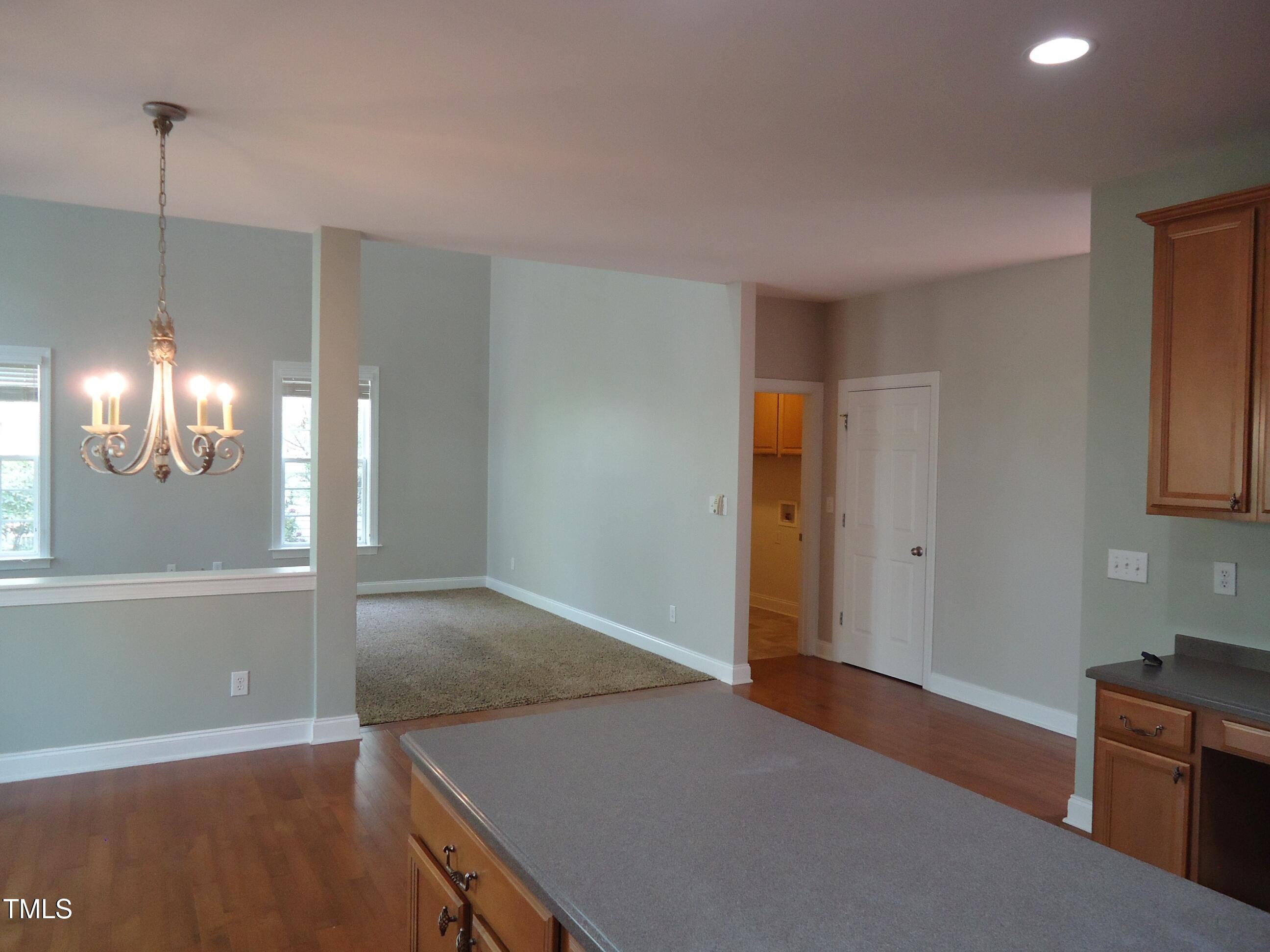 109 Bright Shade Court Holly Springs, NC 27540 - Photo 19 of 46 a view of a kitchen cabinets and a ceiling fan