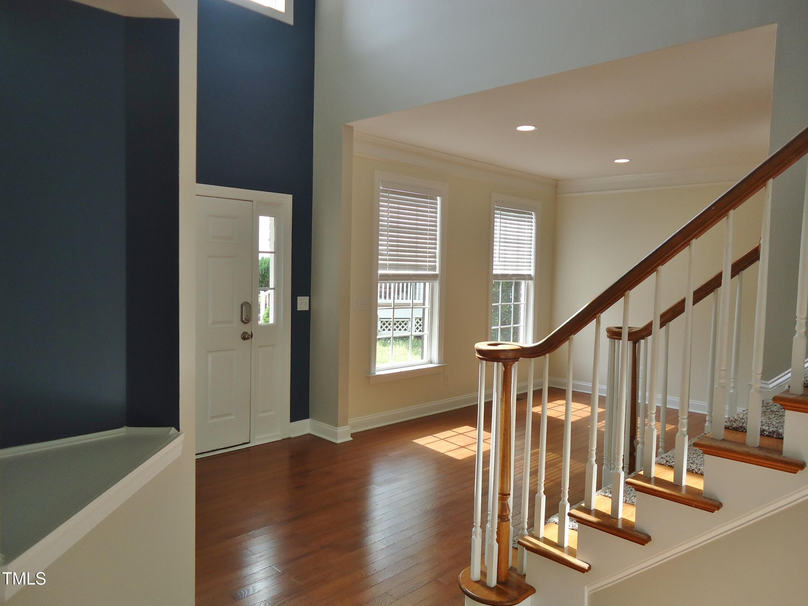 109 Bright Shade Court Holly Springs, NC 27540 - Photo 27 of 46 a view of entryway with wooden floor and stairs