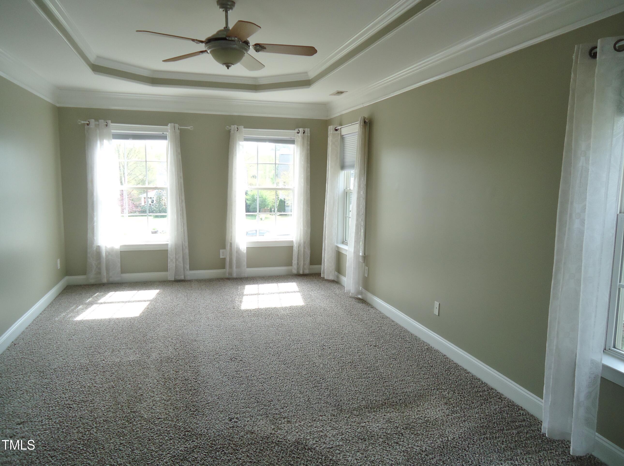 109 Bright Shade Court Holly Springs, NC 27540 - Photo 30 of 46 an empty room with a empty space and windows