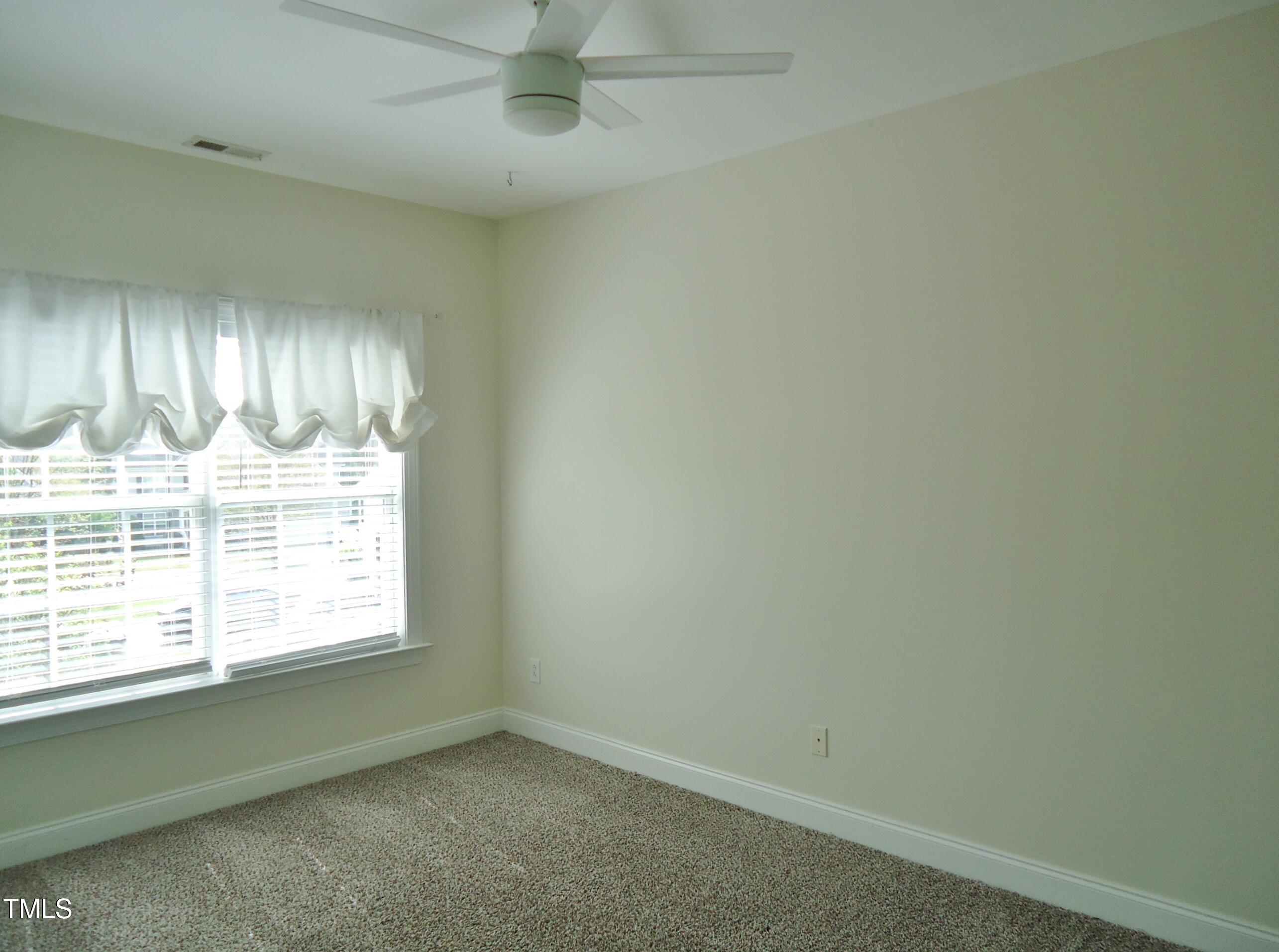 109 Bright Shade Court Holly Springs, NC 27540 - Photo 39 of 46 an empty room with a window
