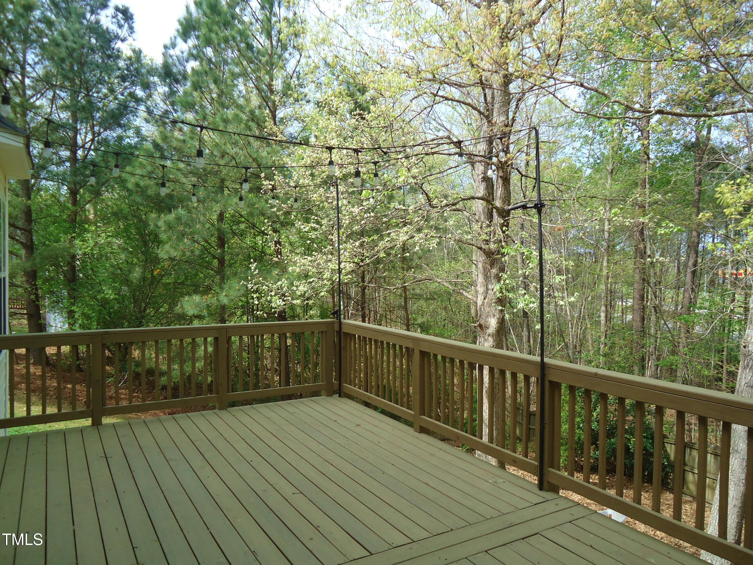 109 Bright Shade Court Holly Springs, NC 27540 - Photo 41 of 46 a view of balcony with wooden floor and fence