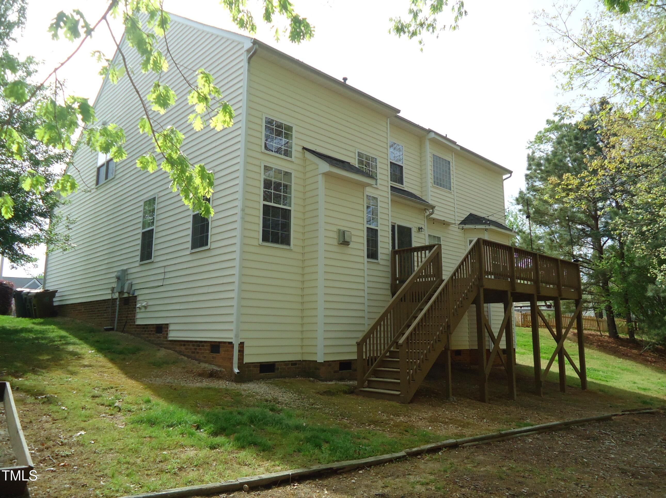 109 Bright Shade Court Holly Springs, NC 27540 - Photo 45 of 46 a view of a house with a backyard
