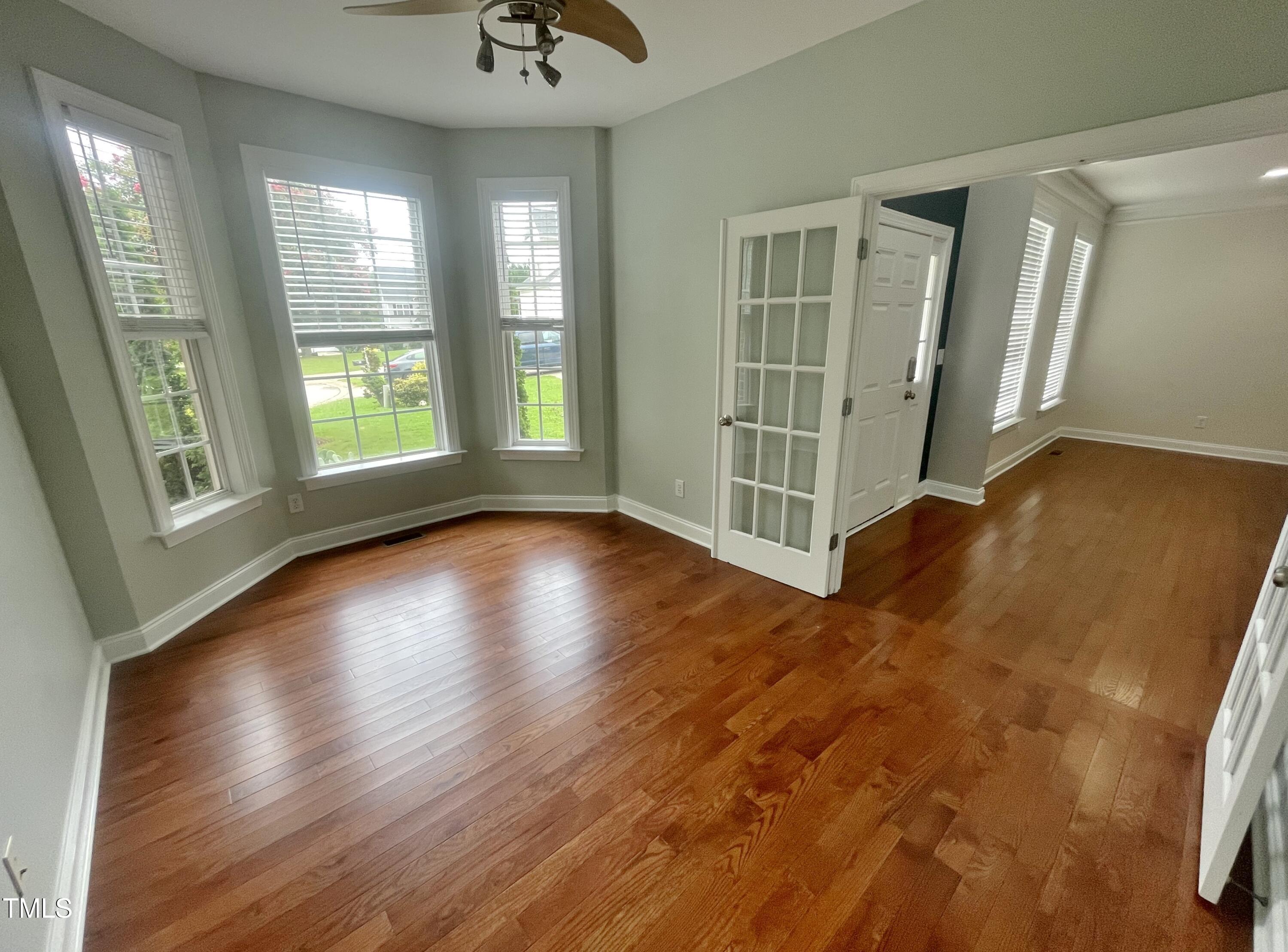 109 Bright Shade Court Holly Springs, NC 27540 - Photo 9 of 46 a view of livingroom with hardwood floor and window