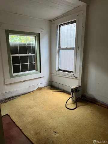 an empty room with windows