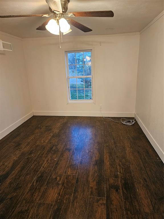 2100 Edna Avenue Waco, TX 76708 - Photo 6 of 8 a view of an empty room with wooden floor and a window