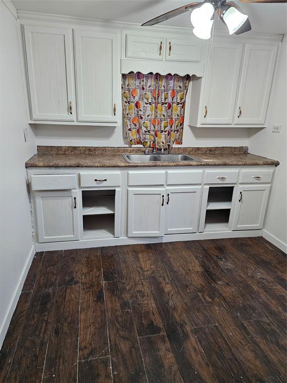 2100 Edna Avenue Waco, TX 76708 - Photo 7 of 8 a kitchen with granite countertop cabinets stainless steel appliances and a wooden floor