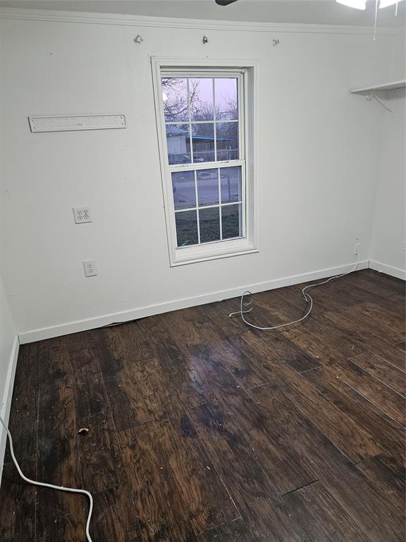 2100 Edna Avenue Waco, TX 76708 - Photo 8 of 8 an empty room with wooden floor and windows