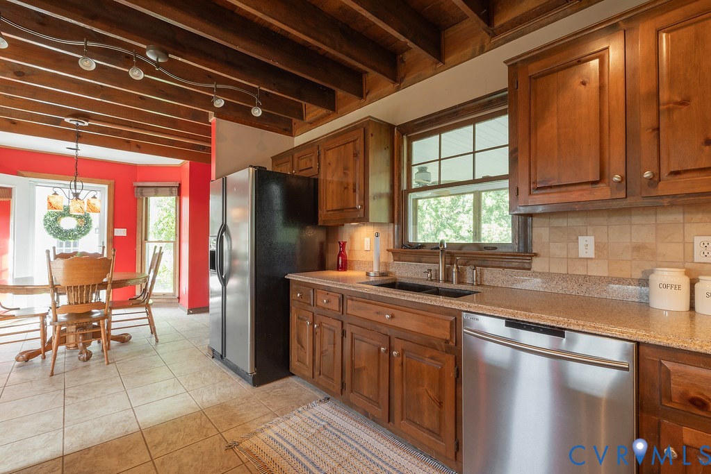 5146 Studley Road Mechanicsville, VA 23116 - Photo 17 of 50 a kitchen with stainless steel appliances granite countertop a refrigerator and a sink