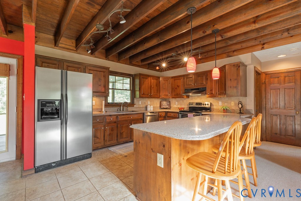 5146 Studley Road Mechanicsville, VA 23116 - Photo 19 of 50 a kitchen with stainless steel appliances granite countertop a sink and a refrigerator