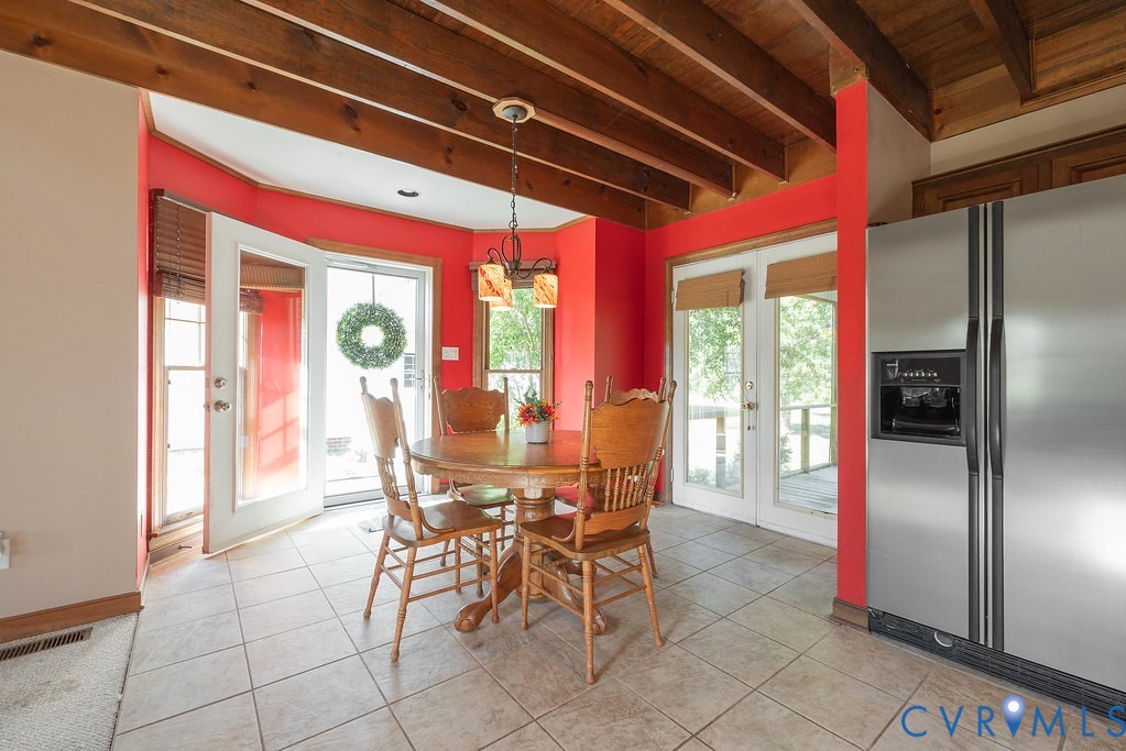 5146 Studley Road Mechanicsville, VA 23116 - Photo 20 of 50 a view of a dining hall with a dining table and chairs