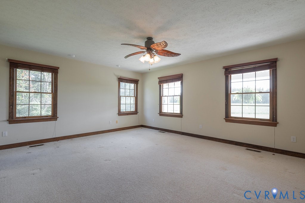 5146 Studley Road Mechanicsville, VA 23116 - Photo 26 of 50 a view of a room with windows and chandelier fan