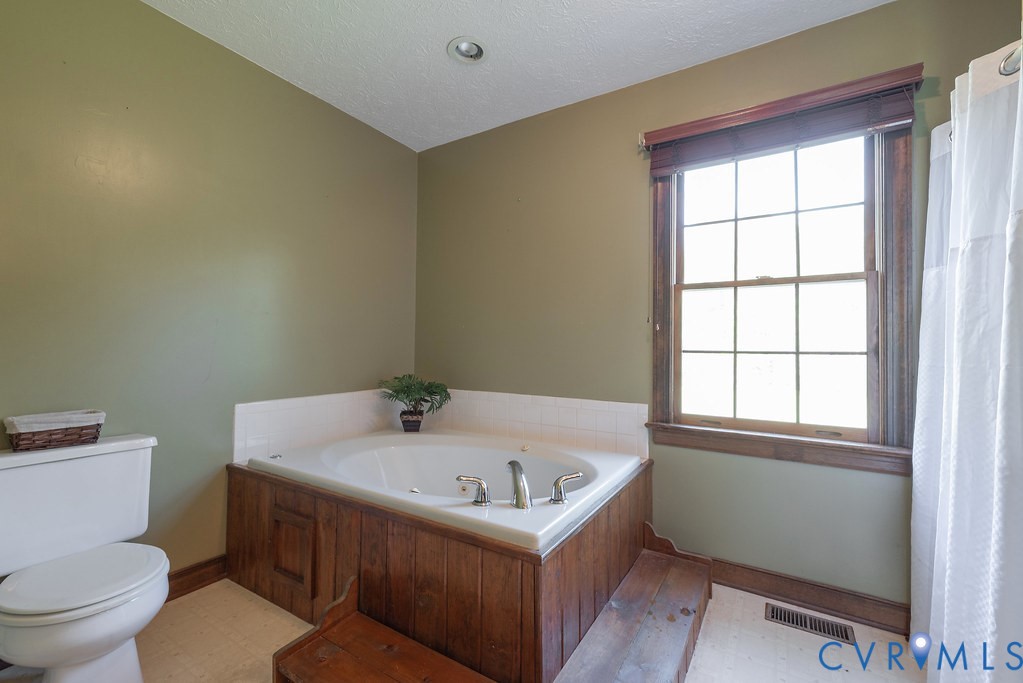 5146 Studley Road Mechanicsville, VA 23116 - Photo 28 of 50 a bathroom with a bathtub and a toilet