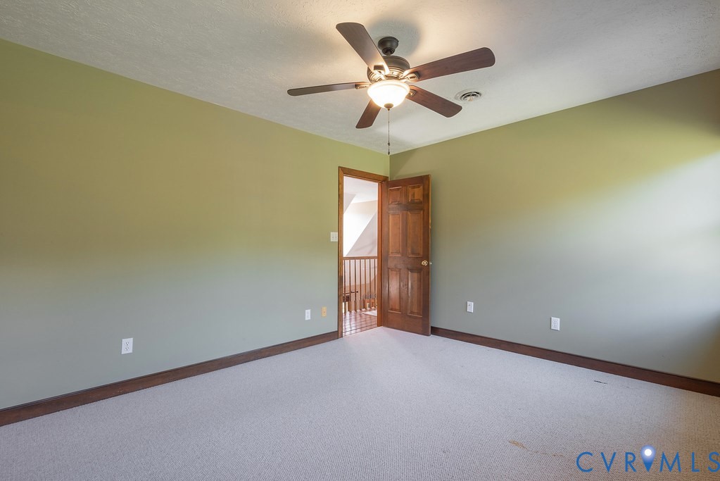 5146 Studley Road Mechanicsville, VA 23116 - Photo 37 of 50 an empty room with a window and a fan