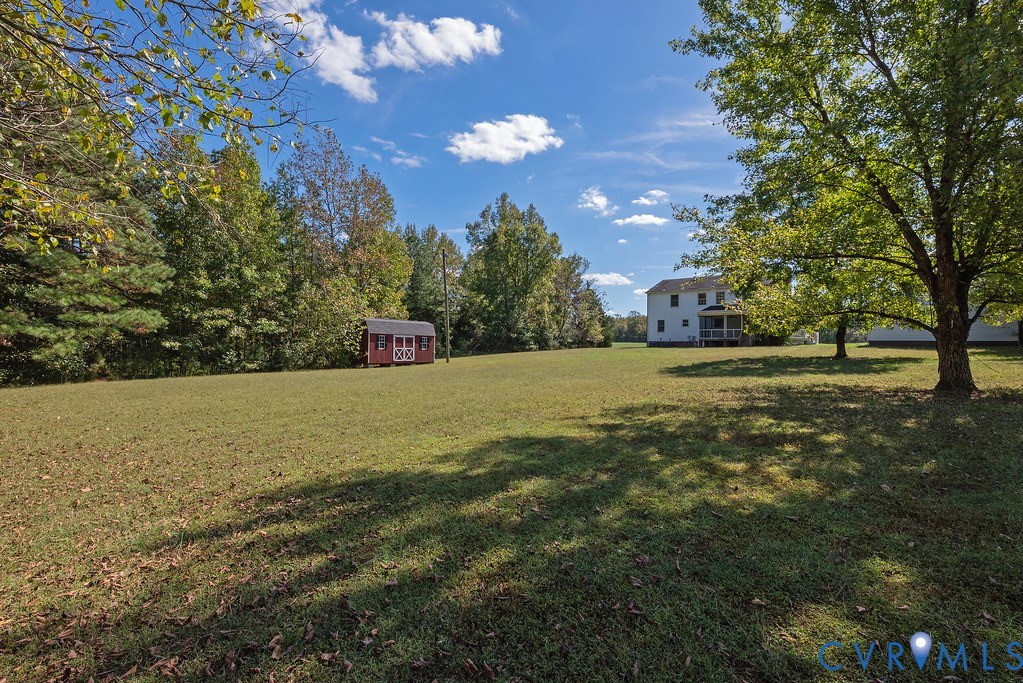 5146 Studley Road Mechanicsville, VA 23116 - Photo 41 of 50 a view of green field with tree in the background