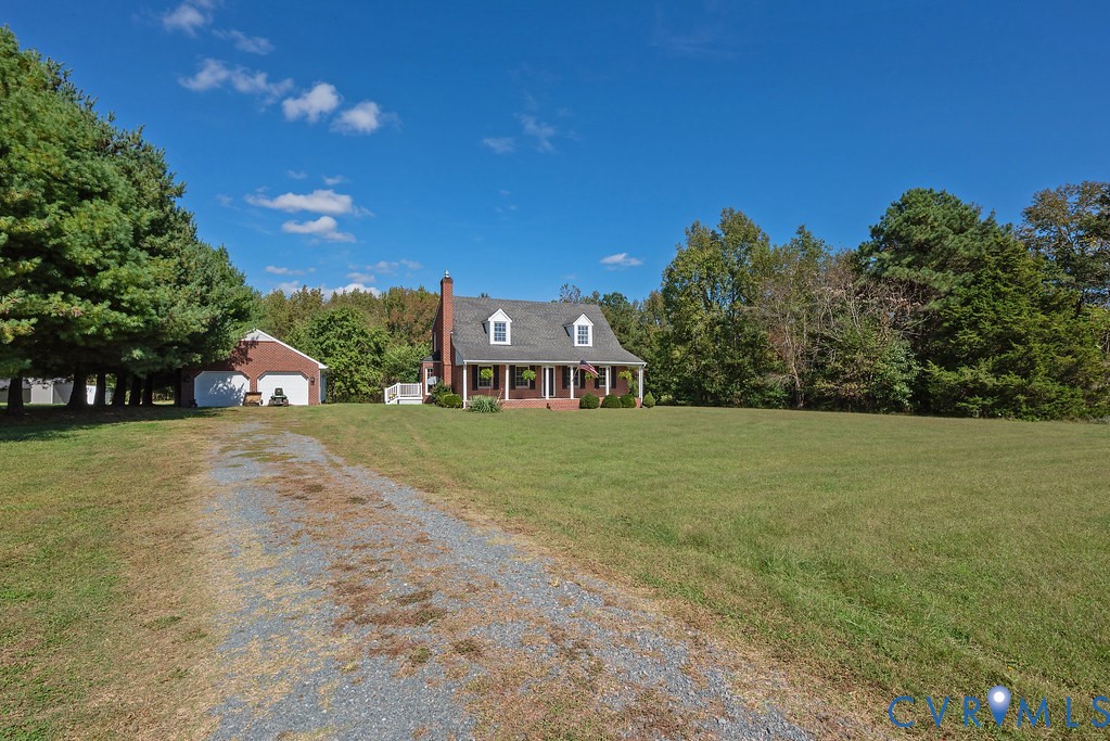 5146 Studley Road Mechanicsville, VA 23116 - Photo 49 of 50 a front view of a house with a yard and trees