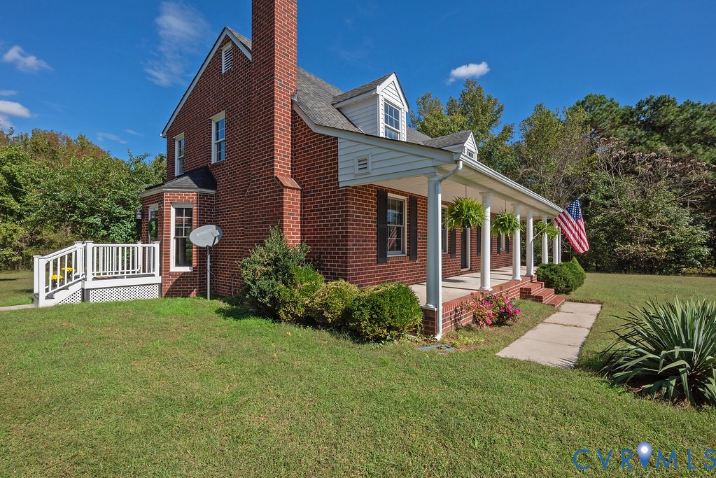 5146 Studley Road Mechanicsville, VA 23116 - Photo 9 of 50 a front view of a house with a yard