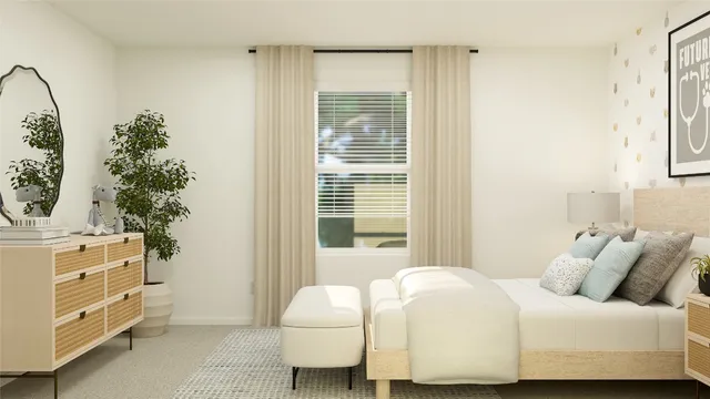 a bedroom with a bed and a potted plant