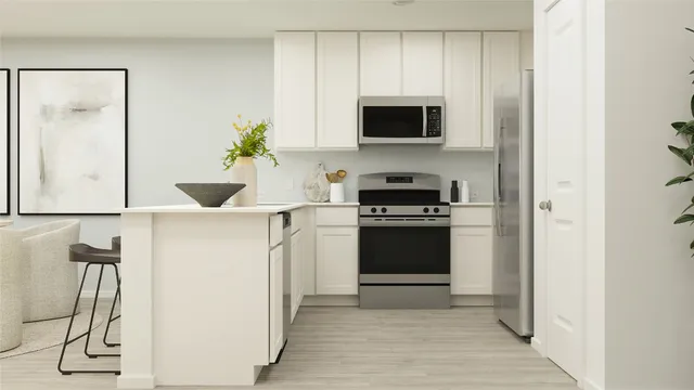 a kitchen with a sink and a stove top oven