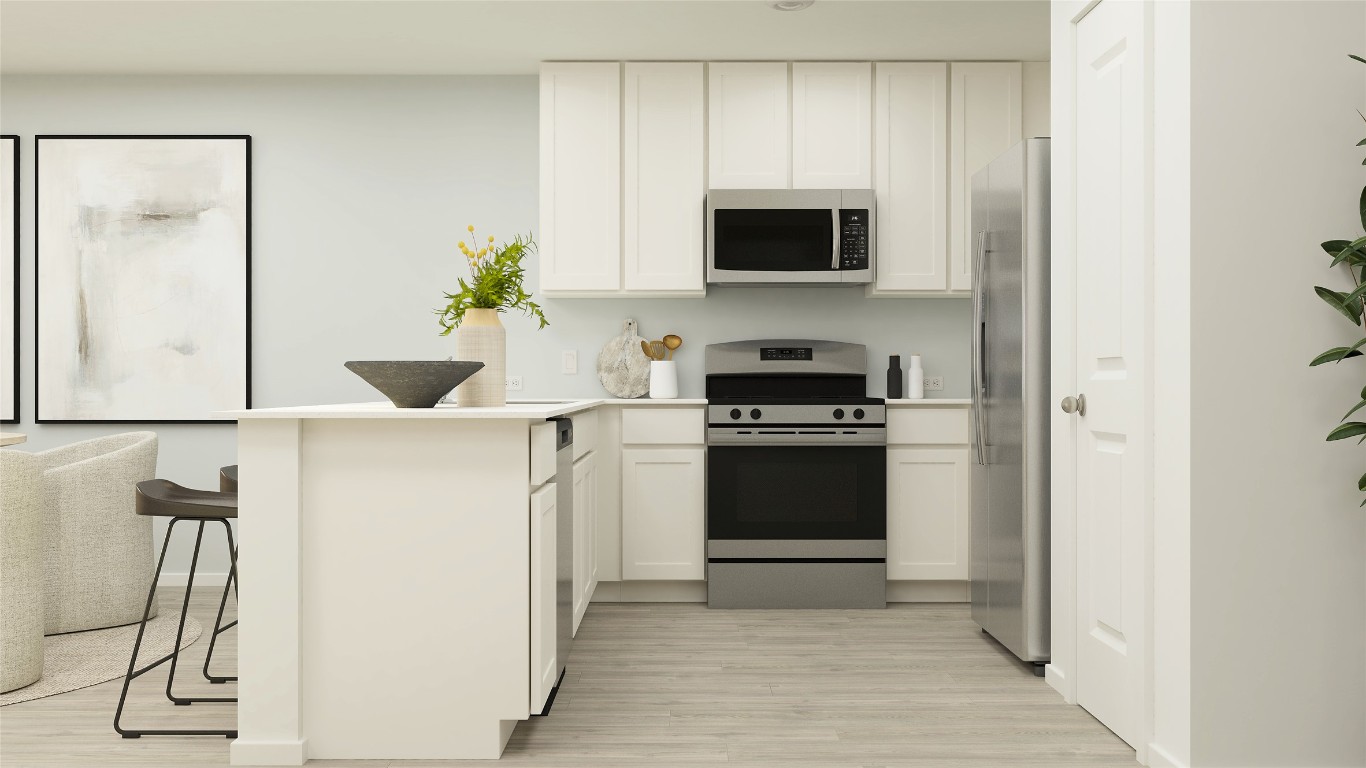 427 Silvercloud Drive Lockhart, TX 78644 - Photo 27 of 37 a kitchen with a sink and a stove top oven