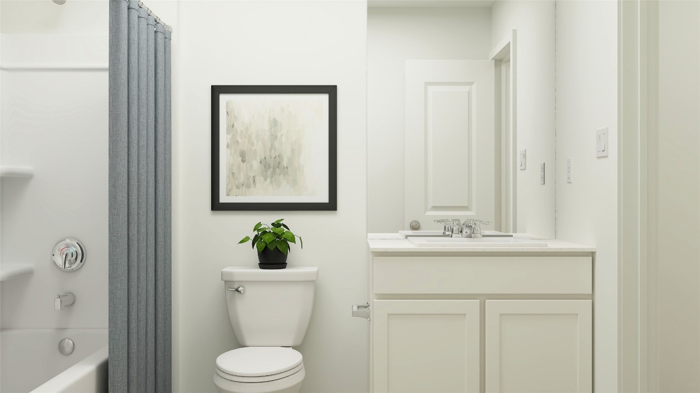 427 Silvercloud Drive Lockhart, TX 78644 - Photo 31 of 37 a bathroom with a toilet a sink and mirror