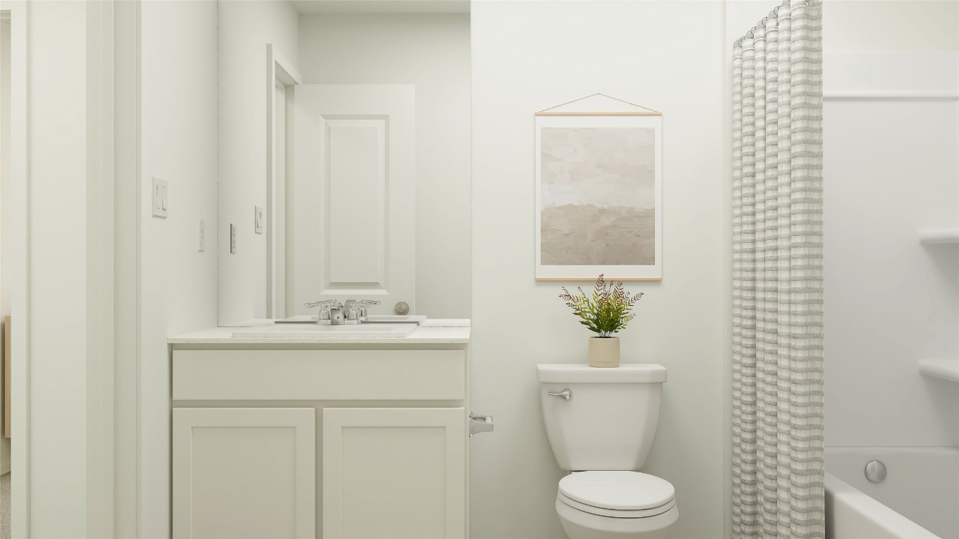 427 Silvercloud Drive Lockhart, TX 78644 - Photo 33 of 37 a bathroom with a sink a toilet and a mirror