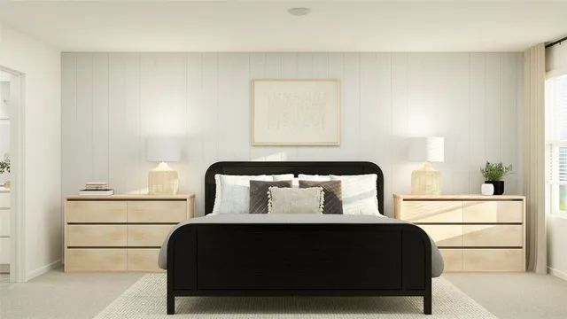 a bedroom with a bed and a night stand