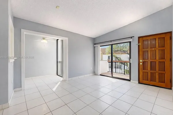 a view of an empty room with a window