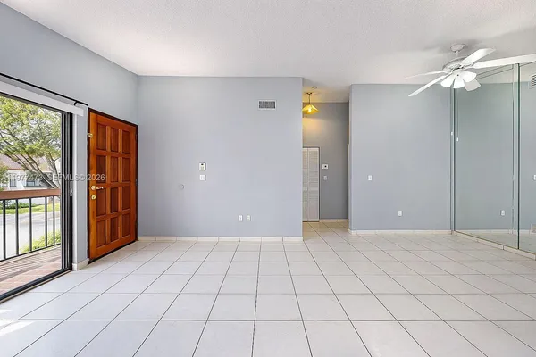 a view of an empty room and window