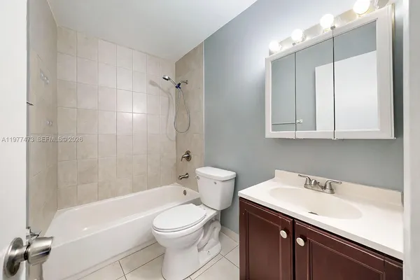 a bathroom with a sink a toilet and a bathtub