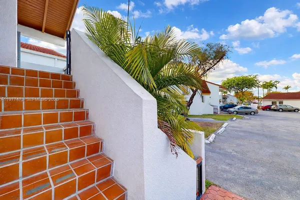 a view of a street with a building in the background