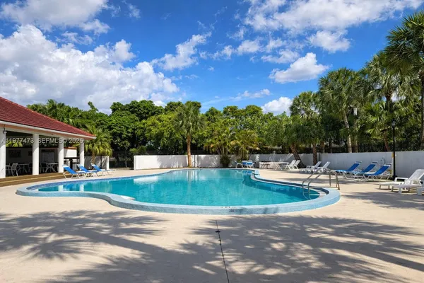 a view of a swimming pool with a patio