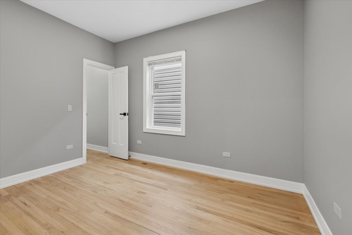 2159 North Parkside Avenue Chicago, IL 60639 - Photo 12 of 23 wooden floor in an empty room