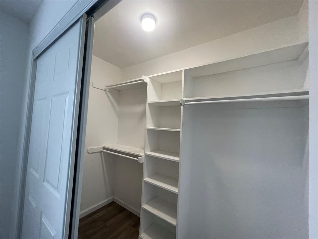 3 Ridge Drive Hickory Creek, TX 75065 - Photo 16 of 20 a view of walk in closet with empty racks