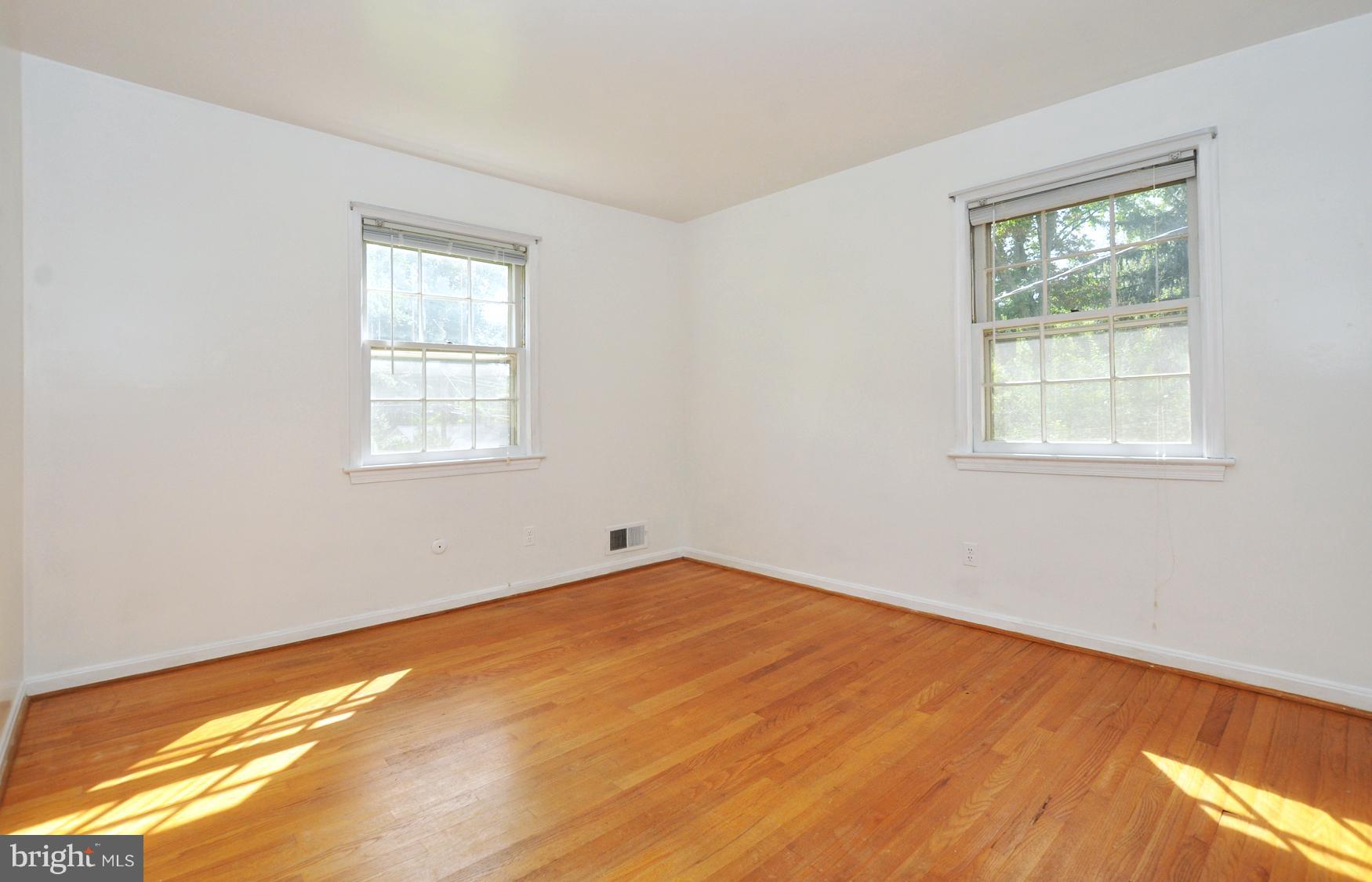 12906 Stonecrest Drive Silver Spring, MD 20904 - Photo 11 of 17 a view of an empty room with wooden floor and a window