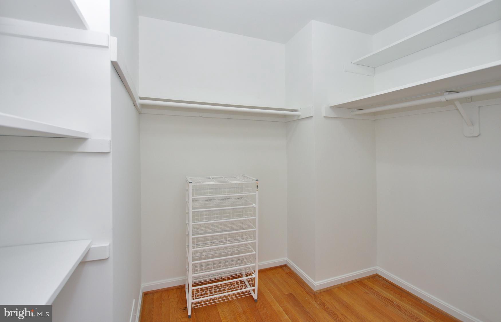 12906 Stonecrest Drive Silver Spring, MD 20904 - Photo 14 of 17 a view of walk in closet with empty racks