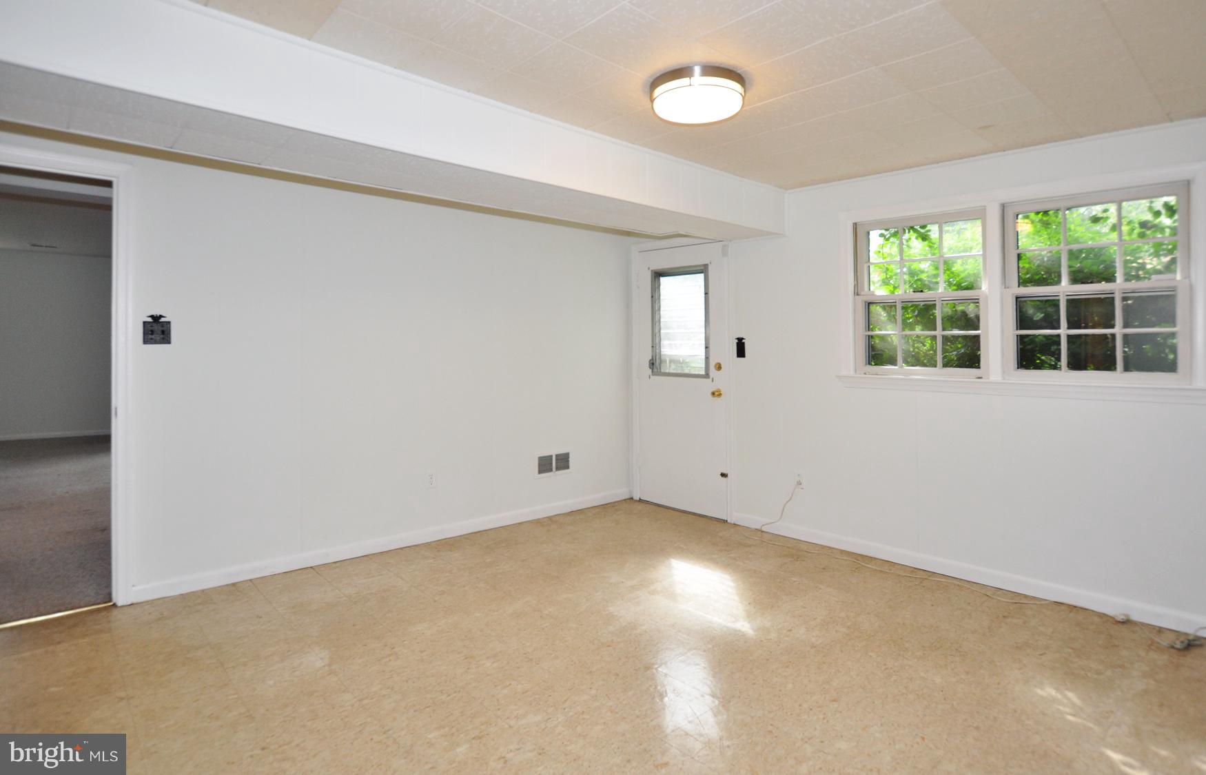 12906 Stonecrest Drive Silver Spring, MD 20904 - Photo 16 of 17 an empty room with a window