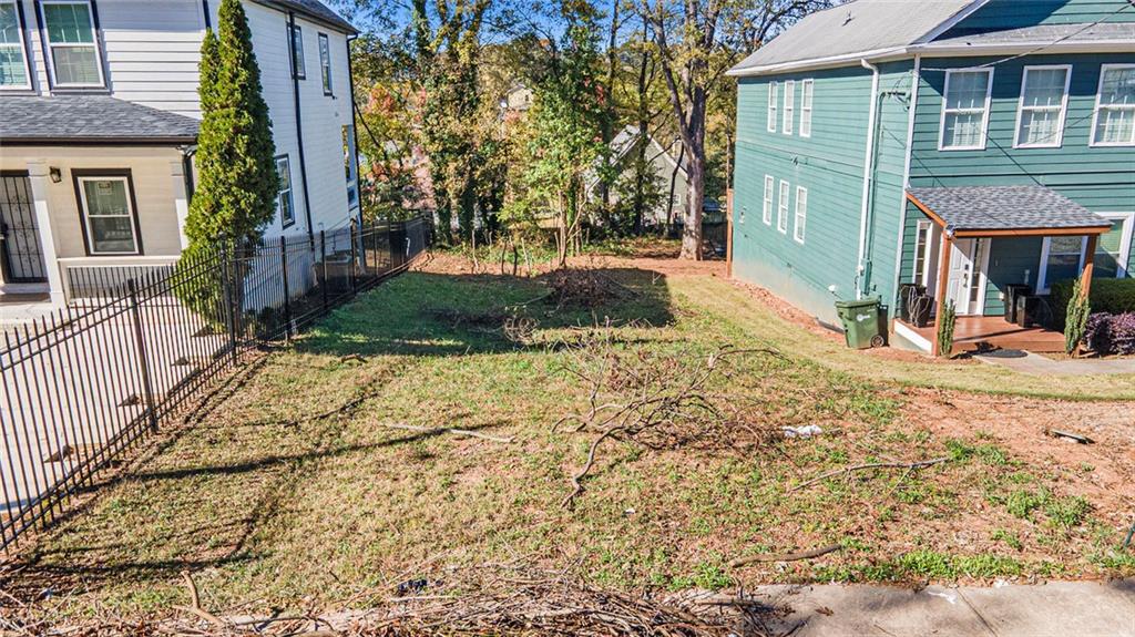 148 Maple Street Northwest Atlanta, GA 30314 - Photo 11 of 16 a view of a house with a yard