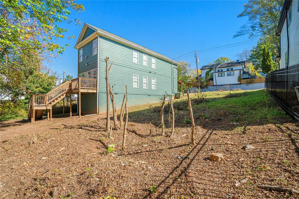 148 Maple Street Northwest Atlanta, GA 30314 - Photo 12 of 16 a view of a house with a yard
