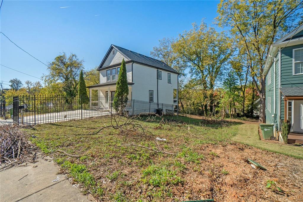 148 Maple Street Northwest Atlanta, GA 30314 - Photo 15 of 16 a view of a house with a yard