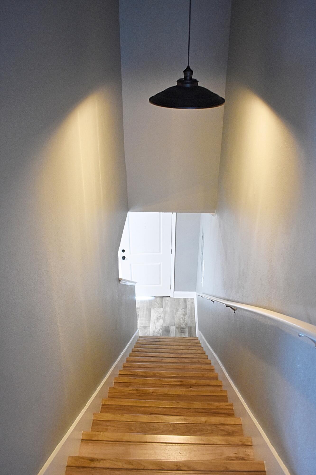 18 South Sand Palm Road, Unit 51 Freeport, FL 32439 - Photo 12 of 16 a view of a room with wooden floor and staircase