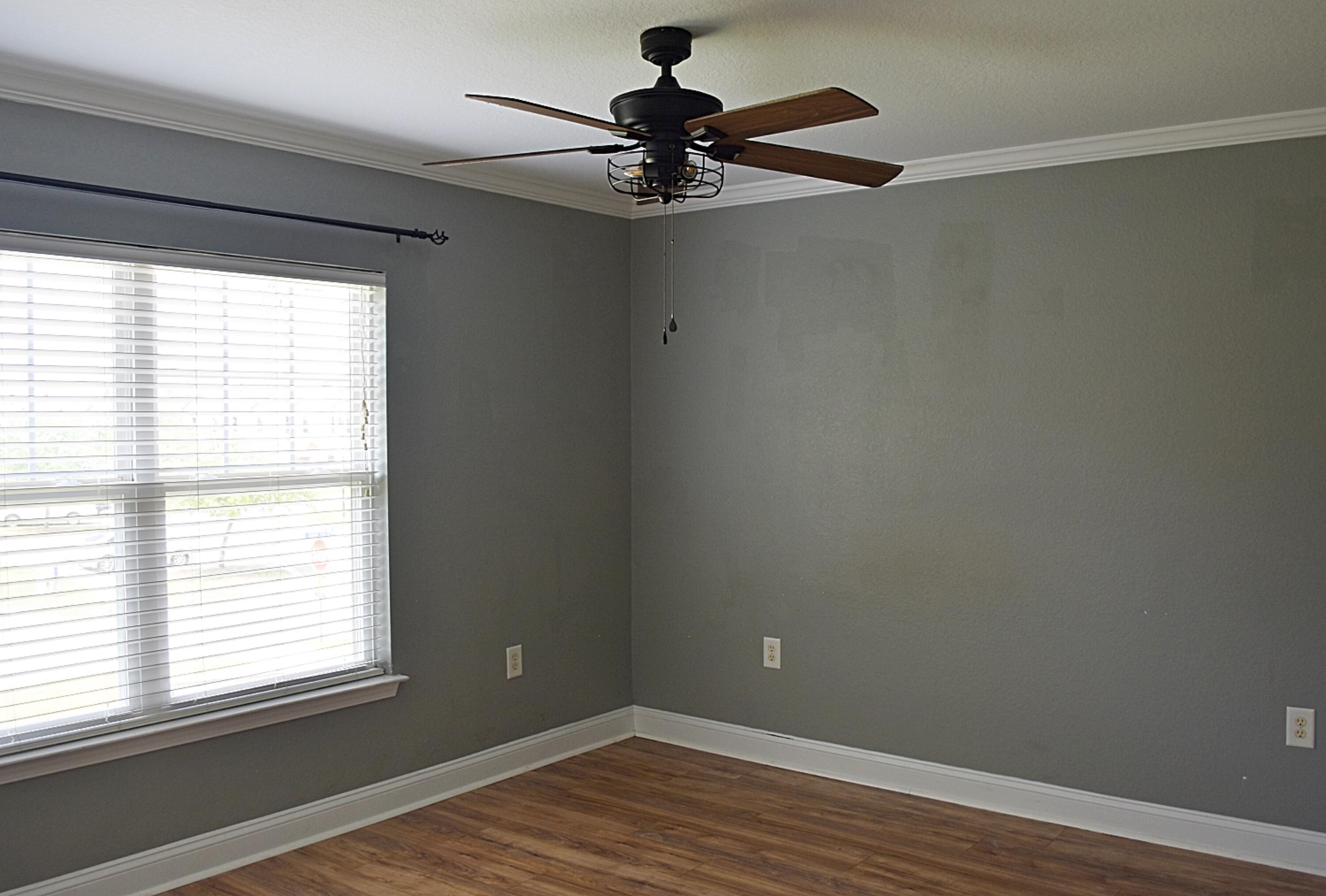 18 South Sand Palm Road, Unit 51 Freeport, FL 32439 - Photo 14 of 16 a view of empty room with wooden floor and fan