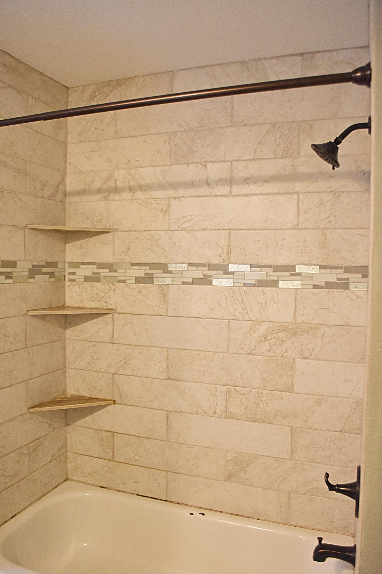 18 South Sand Palm Road, Unit 51 Freeport, FL 32439 - Photo 15 of 16 a bathroom with a shower