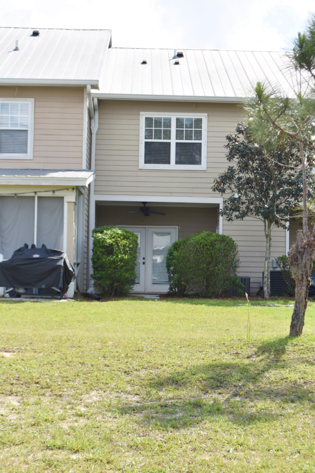 18 South Sand Palm Road, Unit 51 Freeport, FL 32439 - Photo 3 of 16 a view of a house with a swimming pool