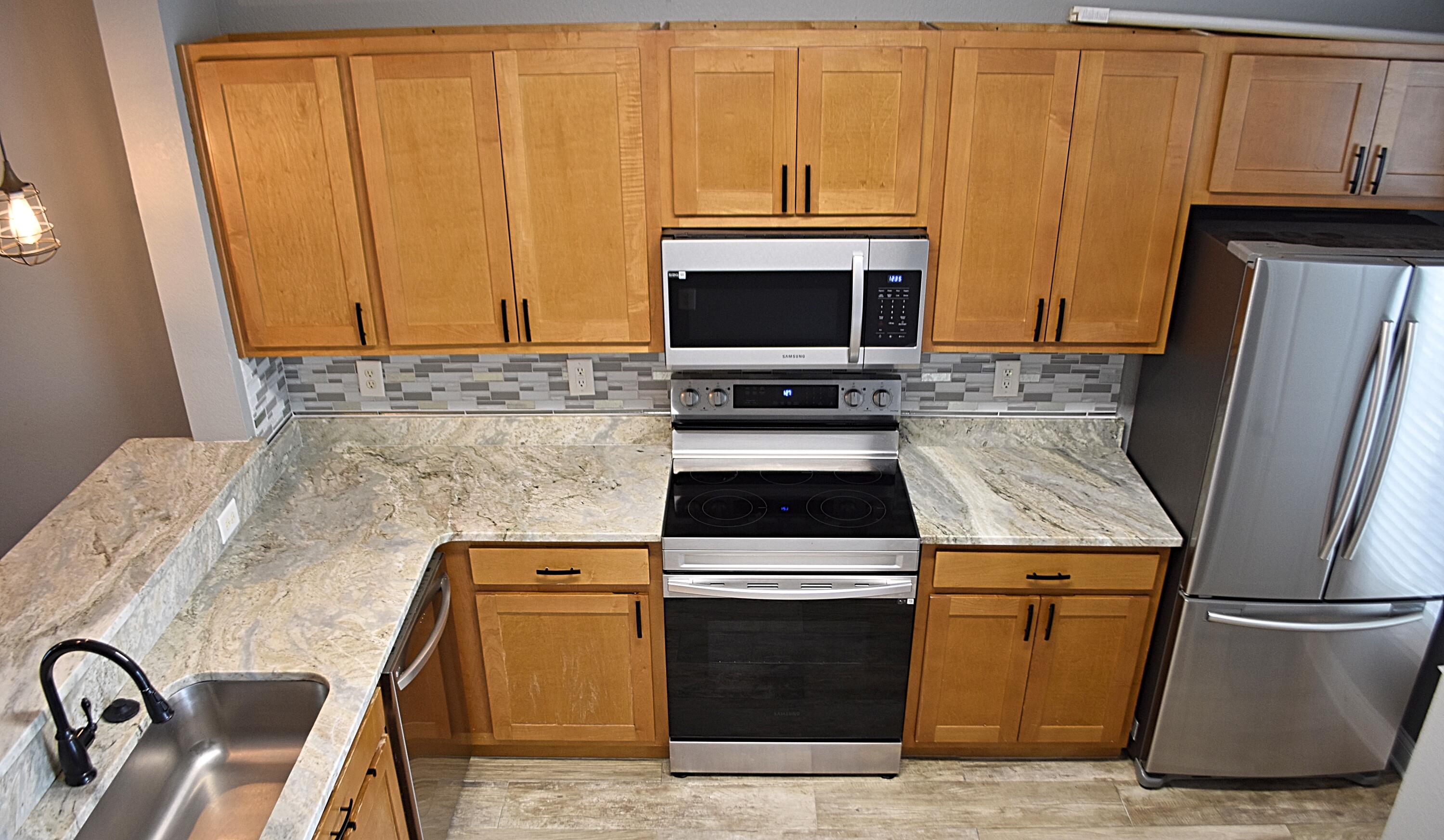 18 South Sand Palm Road, Unit 51 Freeport, FL 32439 - Photo 4 of 16 a kitchen with a stove microwave and refrigerator