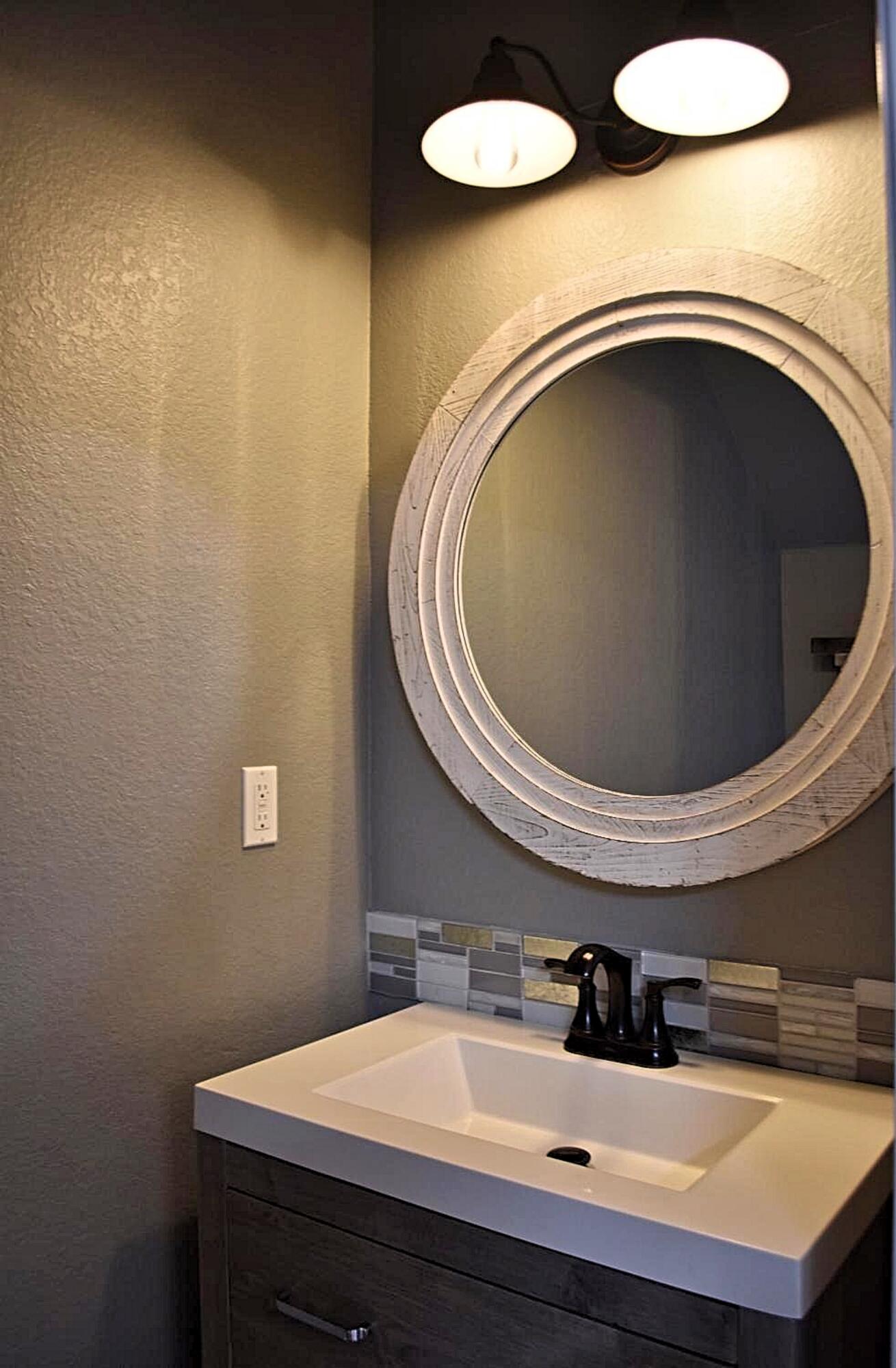 18 South Sand Palm Road, Unit 51 Freeport, FL 32439 - Photo 7 of 16 a bathroom with a sink and a mirror