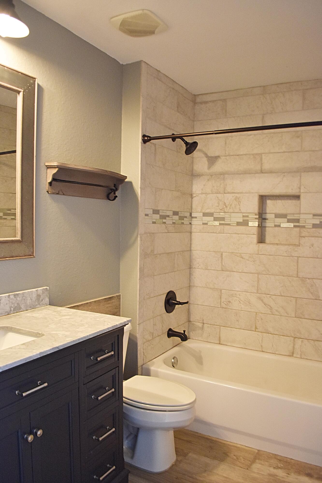 18 South Sand Palm Road, Unit 51 Freeport, FL 32439 - Photo 9 of 16 a bathroom with a sink a toilet and bathtub
