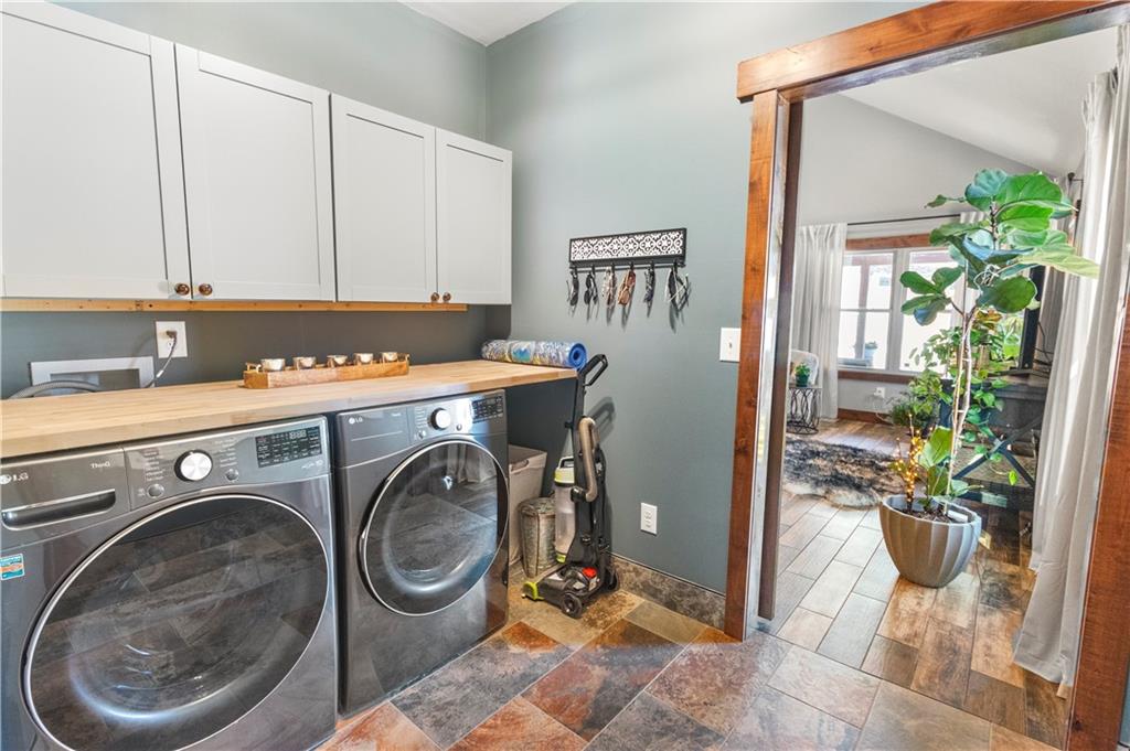 308 Hugh Stowers Road Dawsonville, GA 30534 - Photo 13 of 81 a utility room with sink dryer and washer