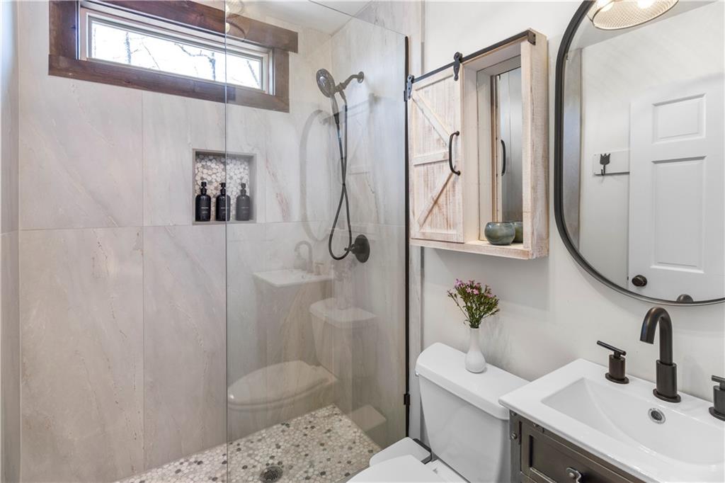 308 Hugh Stowers Road Dawsonville, GA 30534 - Photo 32 of 81 a bathroom with a sink toilet and shower